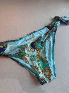 Victoria’s Secret Turquoise & Gold Print side tie bikini bottoms